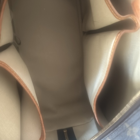 Louis Vuitton and LV wallet included.  There is 2 small marks on the inside - Picture 7 of 16